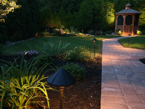 A backyard oasis lit for a quiet evening in Florida